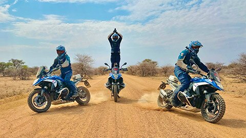 The Indian men’s team were depicted riding in formation, whereby the rider at the centre stands almost bolt-upright on his motorcycle and clasps his hands together over his head.